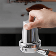 Load image into Gallery viewer, Coffee grounds transferred from dosing cup into 58mm portafilter
