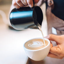 Load image into Gallery viewer, Rhino Coffee Gear 360ml black non-stick milk jug with latte art pouring spout, pouring a heart in latte art on a coffee
